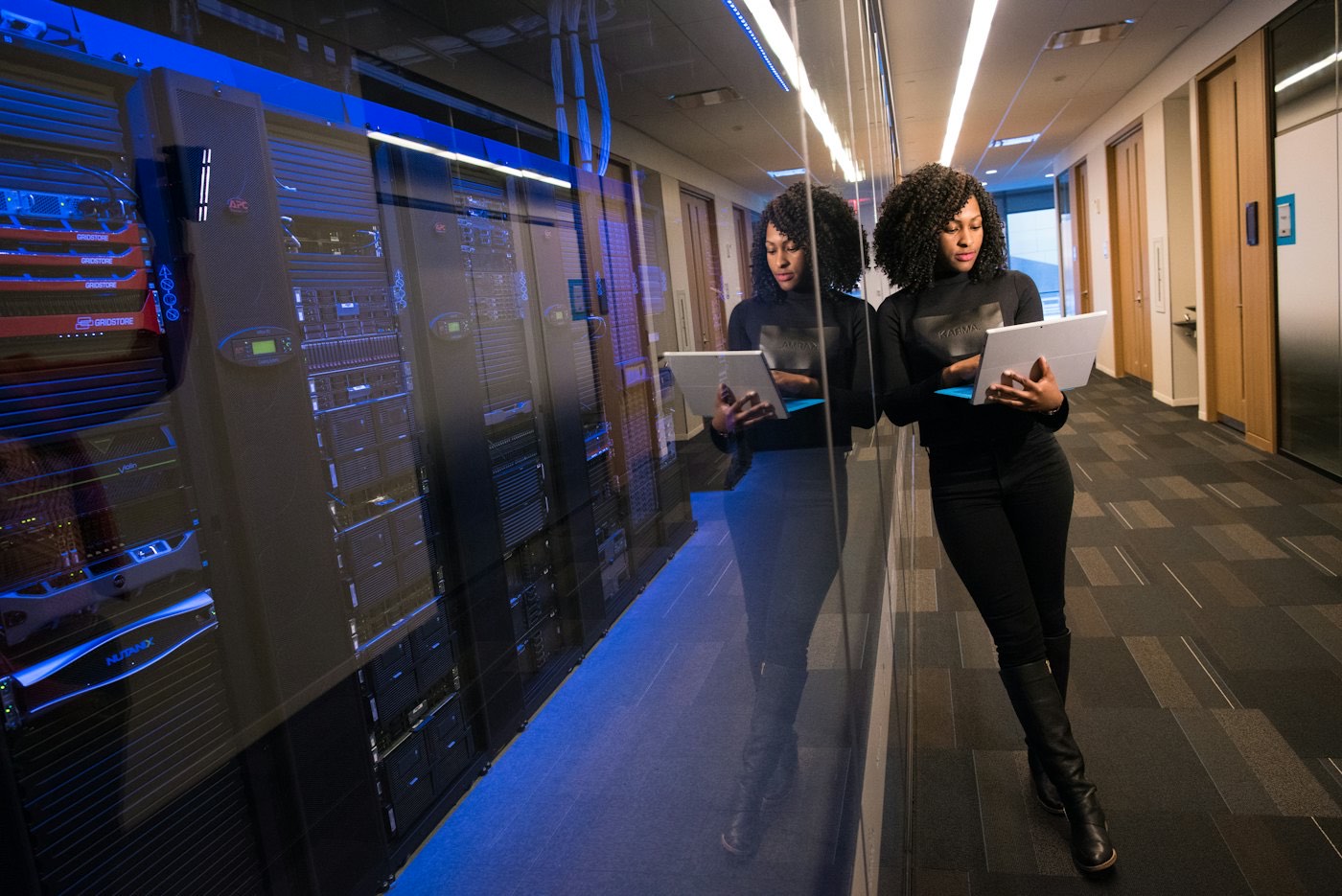 Engineers reviewing infrastructure in a server room